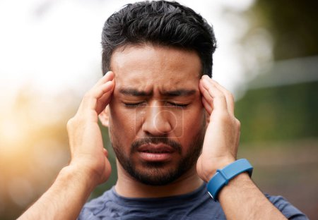 Photo for Face of sports man, headache and pain outdoor for injury, vertigo and tired of exercise problem. Sad asian athlete, sick runner and training with migraine, fatigue or stress of burnout for fitness. - Royalty Free Image