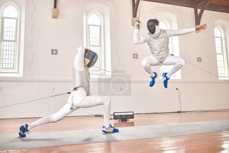 Photo for Jump, fencing and people with sword to fight in training, exercise or workout in a hall. Martial arts, sports and fencers or men with mask and costume for fitness, competition or target in swordplay. - Royalty Free Image