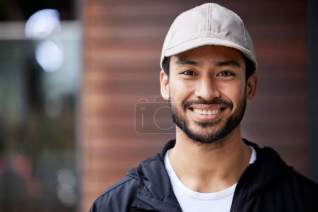 Photo for Courier man, outdoor headshot and portrait for service, delivery or smile for supply chain job. Young logistics worker, face and city for customer satisfaction, mockup space or ecommerce in metro cbd. - Royalty Free Image