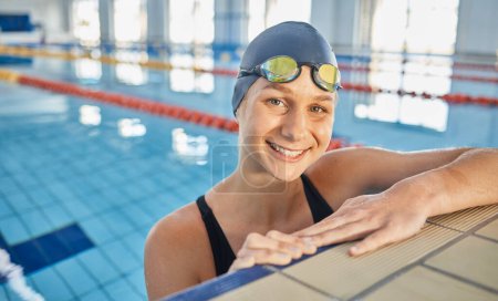 Photo for Water, woman and portrait in swimming pool for competition, training or professional sports or exercise in gym. Swimmer, fitness and smile of happiness and athlete with wellness in cardio workout. - Royalty Free Image