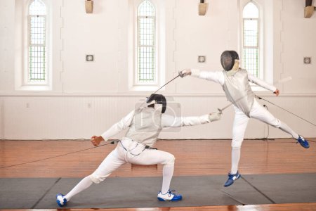 Photo for Fencing, sport and people with sword to fight in training, exercise or workout in hall. Martial arts, stab and fencers or men jump in mask and costume for fitness, competition or target in swordplay. - Royalty Free Image