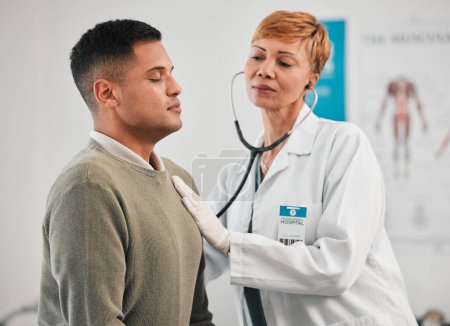 Photo for Doctor, asthma or woman with man breathing for healthcare, nursing or cardiology wellness services. Test tools, help or medical worker checking heart beat with listening equipment in hospital clinic. - Royalty Free Image