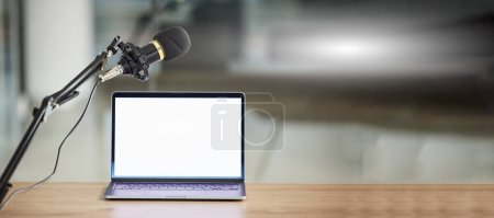 Photo for Laptop, screen with mockup and microphone, radio or podcast with audio equipment, technology and advertising. Multimedia, communication and email with website design layout, news and about us on pc. - Royalty Free Image