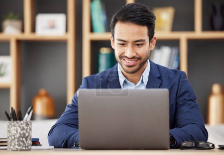 Photo for Man in office with laptop, smile and typing email, proposal or writing online report networking at startup. Happy businessman, computer and administration work for editing, copywriting or web search - Royalty Free Image