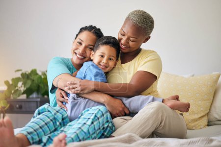 Photo for LGBT, bedroom hug and family portrait, happy child and mothers bond, relax and enjoy time together. Home, bed and gay people, queer parents or lesbian women support, care and hugging adoption kid. - Royalty Free Image