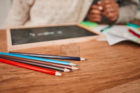 Photo for Hands, helping and child with pencils on table for remote learning, education or writing on board, paper or desk in house. Closeup, drawing and creative kid working on art with parent in home. - Royalty Free Image