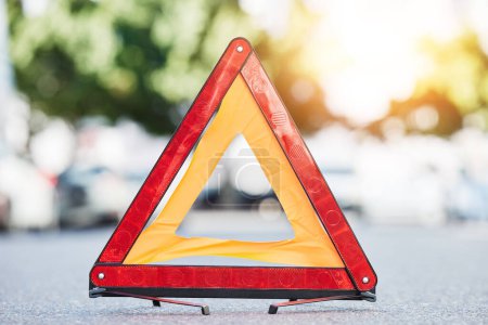 Photo for Red triangle, road sign and stop for emergency, construction or symbol for caution to driver on the ground, floor or street. Attention, warning and signal to traffic of an accident or problem. - Royalty Free Image