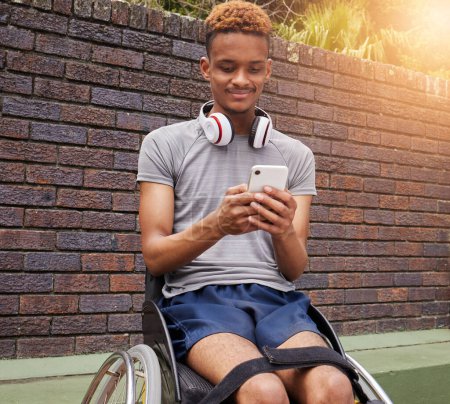 Photo for Phone, wheelchair and outdoor man with disability typing internet, web or online search for fitness training information. Cellphone communication, reading and African person post to social media app. - Royalty Free Image