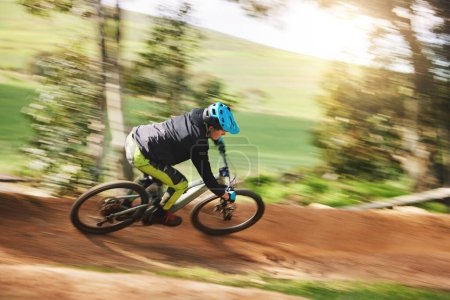 Photo for Mountain bike, man and motion blur in forest for competition, speed or off road adventure on path. Fast athlete, sports and bicycle for contest, cardio race and power in nature, park or action trail. - Royalty Free Image