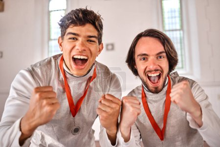 Photo for Team, portrait or men winning a medal for a fighting competition, challenge or sports match. Fencing winners, faces or excited athletes celebrate with reward, victory or prize for games or tournament. - Royalty Free Image