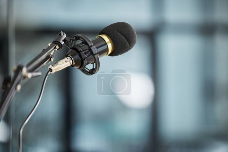 Photo for Conference, auditorium and microphone in an office for a speech, work event or presentation. Bokeh, business and a mic or gear for a meeting, workshop speaker or a corporate seminar at the workplace. - Royalty Free Image