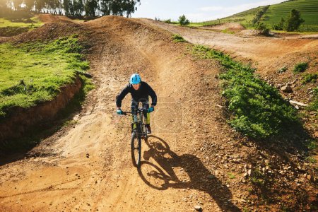 Photo for Cycling, sports and man in nature on bicycle for adrenaline on adventure, freedom and speed. Mountain bike, countryside and cyclist for training, exercise and fitness on dirt road, trail and track. - Royalty Free Image