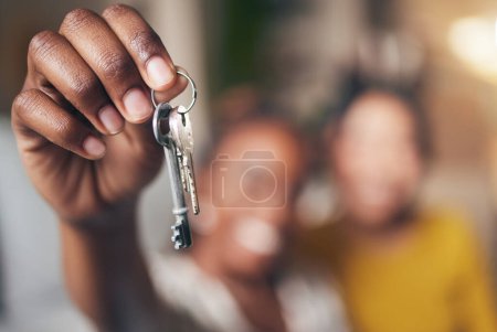 Photo for New home, hand and keys with people moving in together for real estate investment. Rent, mortgage and loan as homeowner celebrate at apartment, property or house with partner for freedom or security. - Royalty Free Image