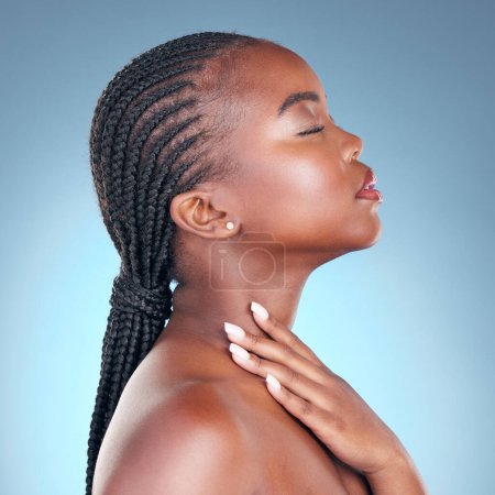 Photo for Skin care, beauty and face of black woman with dermatology, makeup and manicure. Profile of African person on blue background with cosmetics, shine and facial glow with hand for soft touch in studio. - Royalty Free Image