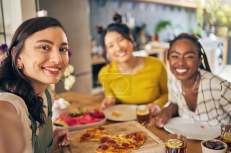 Photo for Friends, selfie and pizza with women in kitchen for happy, social media and fast food. Smile, profile picture and post with portrait of people at home for party, celebration and photography together. - Royalty Free Image