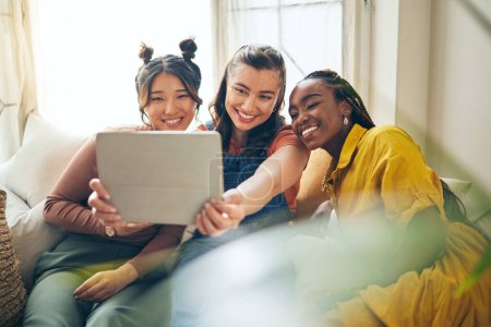 Photo for Home, friends with selfie and women with tablet, social media and blog with profile picture. Female people, technology and group on a couch, bonding and influencer with happiness and content creator. - Royalty Free Image