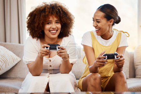 Photo for Portrait of women on sofa playing video game, excited fun and relax in home living room together on internet. Online gaming, esports and happy gamer girl friends on couch on virtual app in apartment - Royalty Free Image
