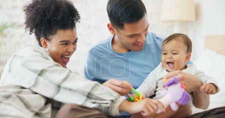 Photo for Family, couple and quality time with baby, mom and dad playing with toys for fun, laughing together in home, bedroom or nursery. Newborn, infant and happiness in motherhood, family or child smile. - Royalty Free Image