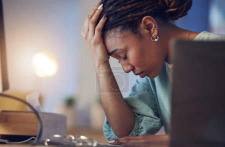 Photo for Business woman, depression and stress in an office at night working late on deadline. Tired African entrepreneur person with hands on head for pain, burnout or regret for mistake or fail at work. - Royalty Free Image