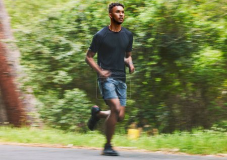 Photo for Man running with speed in park for exercise, fitness and power of cardio workout, action and race. Runner, sports athlete and motion blur for marathon training, energy and fast performance outdoor. - Royalty Free Image