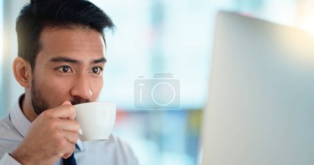 Photo for Focused lawyer sipping a cappuccino while working on a case for his upcoming legal trial. Closeup of the face and head of a young male advocate researching the law on his computer while preparing. - Royalty Free Image