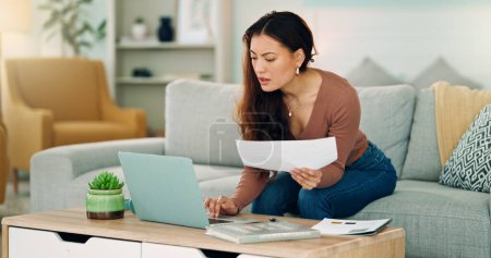 Photo for Woman, paper and laptop in living room on sofa working on project, assignment or task for college or business. Student, girl and home to study, for test or exam at university with handheld movement. - Royalty Free Image