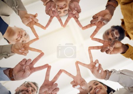 Photo for Peace, hands and business people in office for teamwork, collaboration and support low angle. V, star and happy team in solidarity, commitment or positive coworking agreement, trust or motivation. - Royalty Free Image