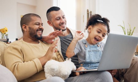 Photo for Gay family, laptop and waving for video call on home sofa with a child for communication and internet. Lgbt men or parents with a girl kid and technology for streaming, connection and happiness. - Royalty Free Image