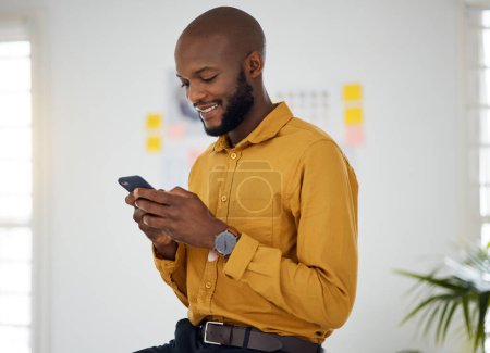 Photo for Business, black man and typing on smartphone in office for social network, mobile website and internet contact. Happy worker scroll on cellphone chat, reading news app and notification of information. - Royalty Free Image