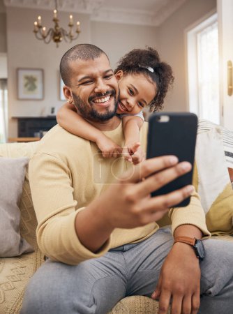 Photo for Home, father and girl with a smile, selfie and social media with connection, family and loving together. People, parent and female child on a couch, profile picture and memory with happiness and love. - Royalty Free Image