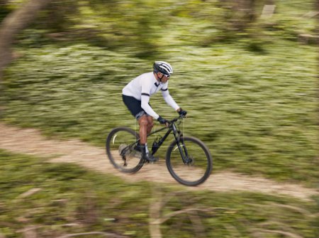 Photo for Cycling, fitness and man with mountain bike in forest for speed, training or nature workout with top view off road race. Extreme sports, bicycle or cyclist in woods for workout, performance or ride. - Royalty Free Image