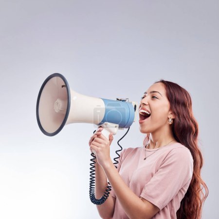 Photo for Discount, megaphone or woman shouting an announcement, speech or sale on white background. Attention, voice or girl with news or broadcast of opinion on mock up space talking on mic speaker in studio. - Royalty Free Image
