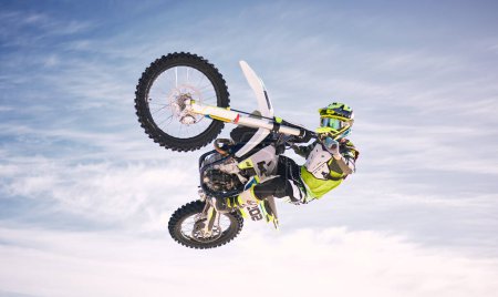 Photo for Sky, jump and man on off road motorbike for practice, training and extreme sports energy in nature. Professional dirt biking adventure challenge, person in clouds and danger in motorcycle competition. - Royalty Free Image