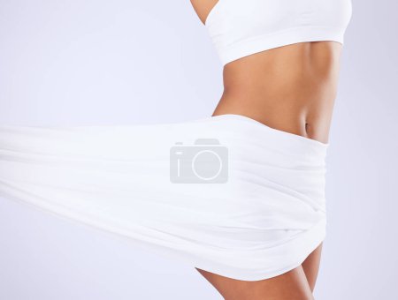 Photo for Beauty, fabric and woman body in studio for epilation, hair removal or self care routine. Health, diet and closeup of slim model figure with silk textile material for glow skin by a white background - Royalty Free Image