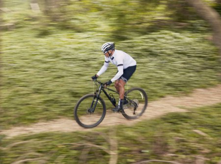 Photo for Fitness, sports and man cycling in forest for speed, training or nature workout with top view off road race. Freedom, workout and cyclist on mountain bike for extreme, adrenaline or power performance. - Royalty Free Image