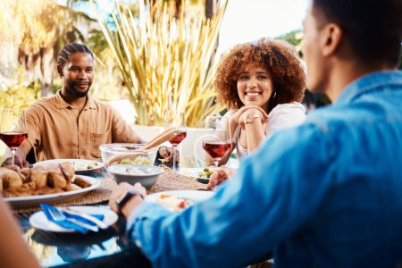 Photo for Happy, friends and lunch in a garden with conversation, eating and bonding at a table. Smile, laughing and diversity of a woman and men in a backyard with food, conversation or dinner together. - Royalty Free Image
