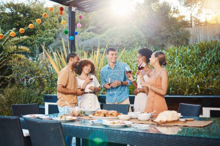 Photo for Smile, diversity and friends at lunch in a garden with drinks, conversation and talking at a party. Happy, alcohol and group of men and women at an outdoor backyard dinner with communication. - Royalty Free Image