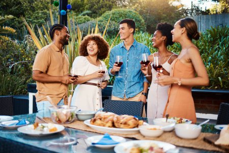 Photo for Chat, friends at dinner in garden at party and celebration with diversity, food and wine at outdoor event. Conversation, men and women at table, fun people with sunset drinks in backyard together - Royalty Free Image