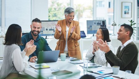 Photo for Happy business people in meeting at desk with applause, cheers and celebration of sales target achievement. Clapping, praise and congratulations with success, motivation for men and women in office - Royalty Free Image