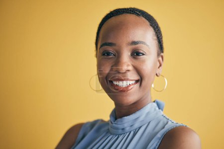 Photo for Portrait, business and black woman with a smile, career and entrepreneur on a yellow studio background. Face, happy person and employee with a startup, professional and empowerment with mockup space. - Royalty Free Image