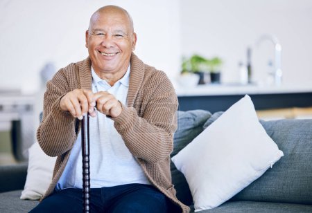 Photo for Portrait, home and old man with a smile, walking stick and relax with retirement, peace and calm on a couch. Senior person in a living room, elder or pensioner on a sofa, cane or support with health. - Royalty Free Image