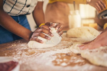 Photo for Bakery, hands and baking by people or chef on a kitchen table cooking bread, pizza or pastry with dough. Culinary, counter and person preparing food at a restaurant with ingredient or recipe. - Royalty Free Image