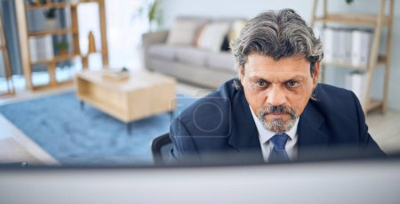 Photo for Mature businessman, reading and computer in home, apartment or corporate employee with remote work in lounge. Distance, working and manager with project, report or review on pc in house office. - Royalty Free Image