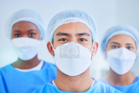 Photo for Surgeon group, face mask and people in hospital, healthcare and wellness expert in clinic. Portrait, doctor and medical professional team, nurse worker and confident surgery employee in ppe scrubs. - Royalty Free Image