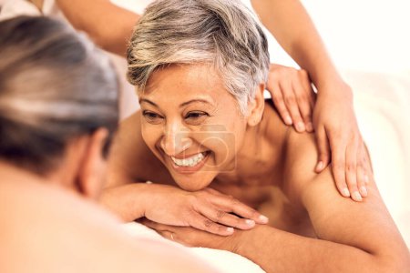 Photo for Spa, relax and couple on massage table for luxury, resort and vacation with stress relief, zen and anniversary. People, mature man and senior woman with happiness, holiday and body care with wellness. - Royalty Free Image