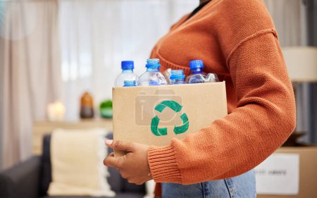 Photo for Plastic, recycling and woman with bottle in box in home for eco friendly, reusable and renewable trash. Sustainability, conservation and person with container to reduce waste, litter and garbage. - Royalty Free Image