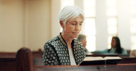 Photo for Bible, religion and a senior woman in a church for a sermon on faith or christian belief while sitting in a pew. Prayer, worship or reading with an elderly female person hearing about God and Jesus. - Royalty Free Image