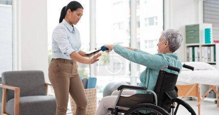 Photo for Woman with disability, physiotherapy and dumbbell exercise for healthcare assessment, test or digital checklist of medical progress. Physiotherapist, tablet or consulting senior patient in wheelchair. - Royalty Free Image