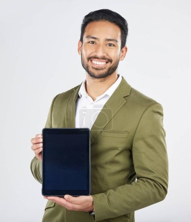 Photo for Happy asian man, portrait and tablet on mockup in advertising against a white studio background. Businessman with technology display or screen in marketing, advertisement or branding on mock up space. - Royalty Free Image