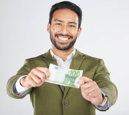 Photo for Happy asian man, portrait and money in finance, savings or investment loan against a white studio background. Businessman smile with cash, euro or bill in financial freedom, profit or salary increase. - Royalty Free Image